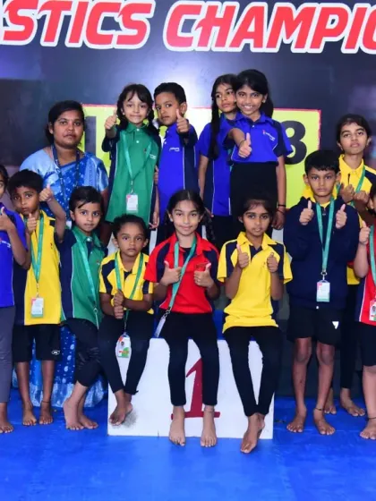 A group of proud winners with their medals at our championship event. We celebrate every participant for their courage and hard work.