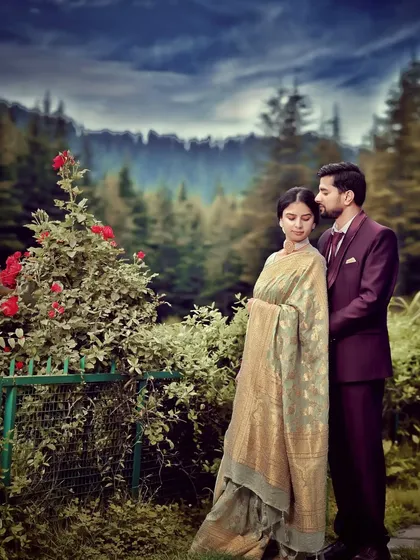 A tender moment between the couple in a lush garden with the mountains in the distance. The soft lighting and natural surroundings create a serene and romantic atmosphere.