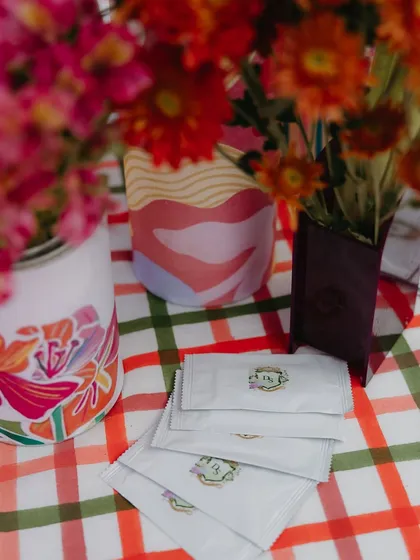 Custom-branded wet wipes for a carnival-themed Mehendi. No detail is too small when it comes to creating a cohesive, branded experience.