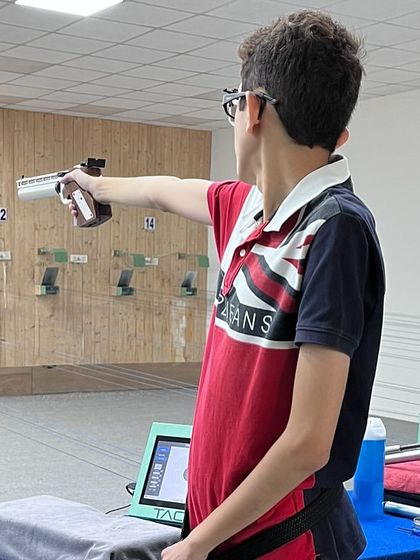 Satvik Gupta demonstrating intense focus during the 10m Air Pistol event at the 67th National Shooting Championship.