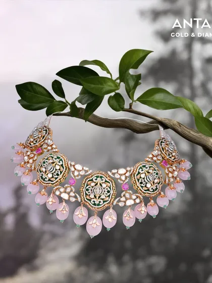 Inspired by nature, this bridal necklace combines the soft blush of rose quartz beads with the timeless elegance of polki and emeralds. It is a piece designed to celebrate a bride's grace and tell her unique story.