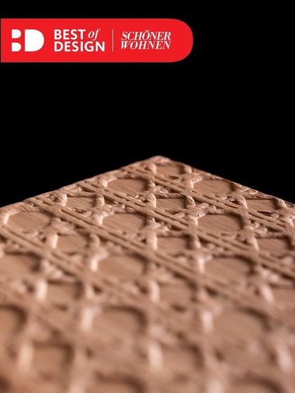 A close-up of the award-winning Viennese wickerwork veneer, showcasing the intricate detail and craftsmanship that goes into this unique finish.