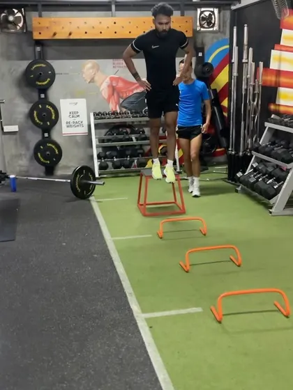 A box jump to hurdle hop sequence. We progress plyometrics from simple to complex to safely build power and coordination.