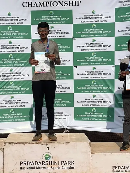Piyush clinches the bronze medal in the 100-meter sprint at the PDP Athletic Competition. His smile shows the joy of seeing hard work pay off.