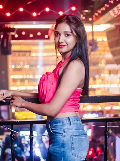 A guest posing on the stairs of the club.