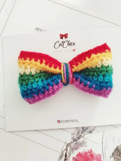A classic rainbow bow, crocheted with all the colors of the rainbow. This can be attached to a clip or a headband.