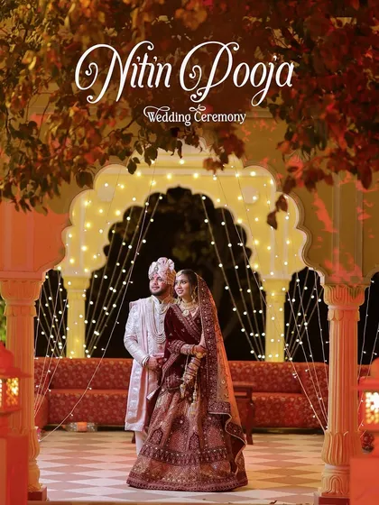 A stunning portrait of a couple at their destination wedding in Jaipur, framed by beautiful architecture and fairy lights.