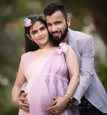 A happy couple posing together during their maternity session. We focus on capturing the love and excitement you share.