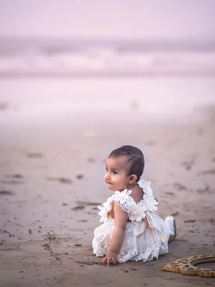 Looking out at the vast ocean. There's a sense of wonder and calm in this beautiful shot from a beach-side sitter session.