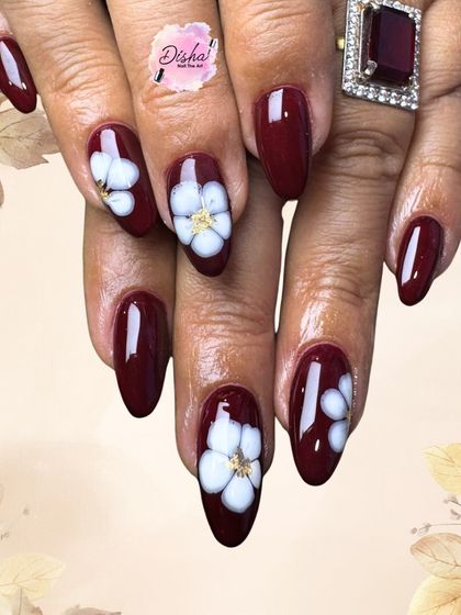Blooming beauty in every maroon stroke. This elegant set features a deep maroon base with delicate, hand-painted white flowers.