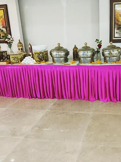 A vibrant pink-themed buffet setup for 50 guests. My supervisor, Mr. Sunil Kumar, is seen here ensuring the setup is perfect before the event begins.