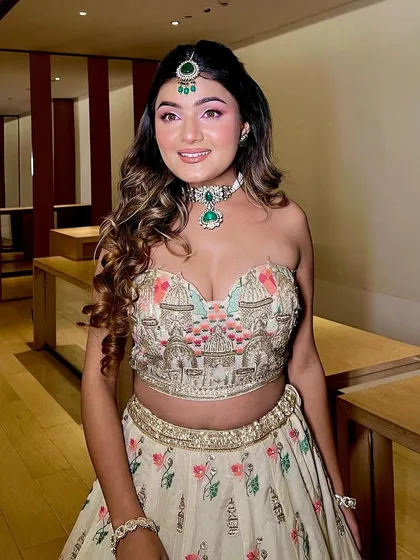 A full portrait of the bride in her beautiful floral Haldi outfit. The makeup ties the whole look together perfectly.