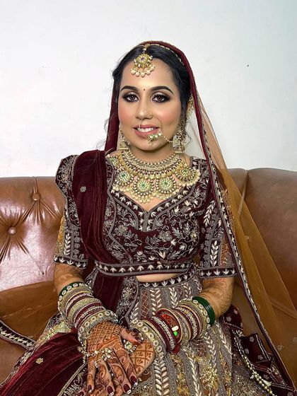 A beautiful bridal look featuring halo eyes and nude lips. This makeup style enhances the bride's features while maintaining a sense of classic elegance.