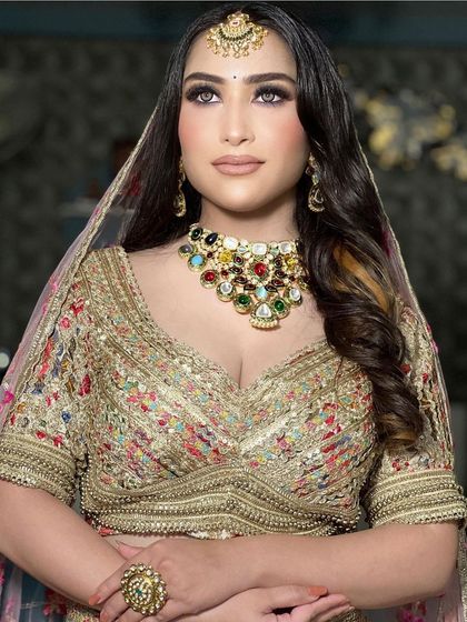 A gorgeous floral embroidered lehenga in a light, creamy base. This is a perfect example of a sophisticated and elegant choice for a day wedding or engagement.