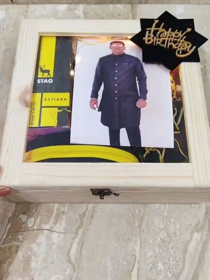 Another look at the personalized wooden box, showing how the photo and 'Happy Birthday' sign are displayed on the transparent lid.