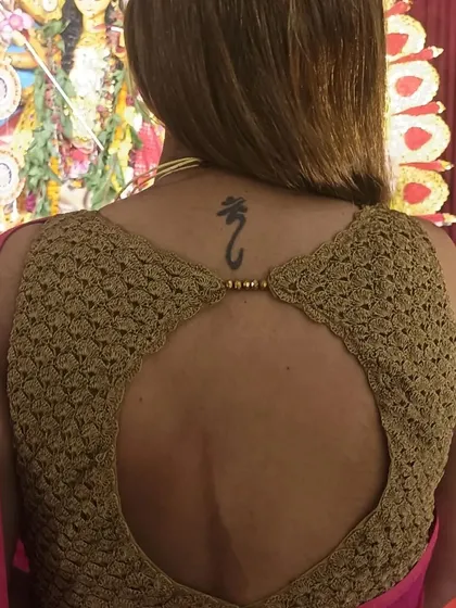 The back of a blouse is just as important as the front. This custom-designed piece features an open-back design with a simple, elegant closure, showcasing how our crochet blouses can be both traditional and modern.
