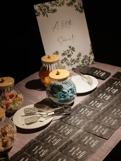A "Little Sweet" candy bar where guests could pack their own bag of treats. It's a simple, interactive detail that adds a layer of fun to any event.