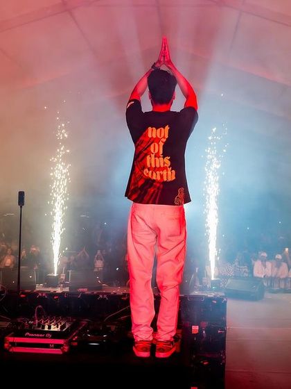 A moment of calm and respect, with a 'namaste' to the audience.