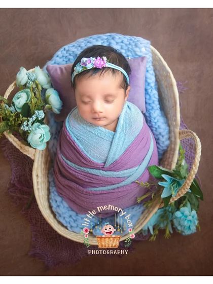 I love the combination of purple and blue in this setup. The colors are rich and beautiful, and the flowers add a soft, delicate touch.