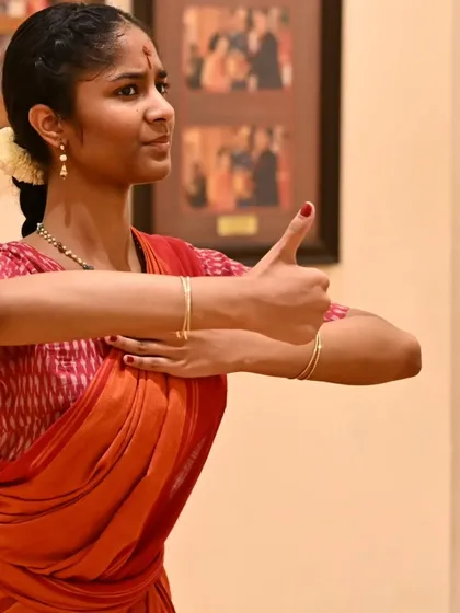 Anvita practicing a specific mudra, or hand gesture, during a rehearsal. The precision of each movement is honed through countless hours of practice.