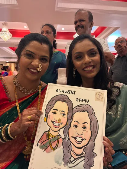 Two women, possibly mother and daughter, proudly display their dual caricature at a family function, capturing their likenesses in vibrant watercolor.