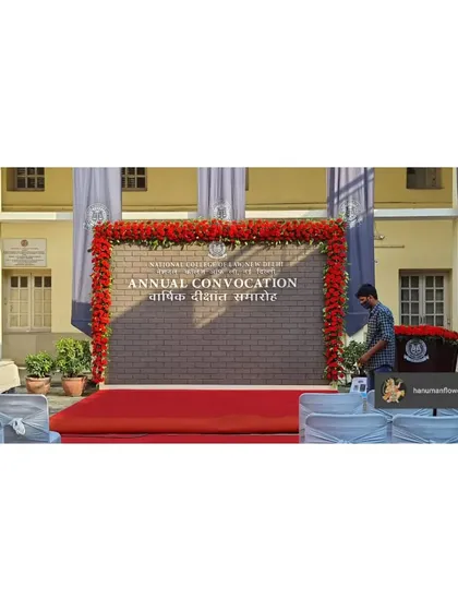We were honored to decorate the annual convocation for the National Law University, Delhi. This stage backdrop, framed with a bold red floral border, provided a dignified and professional setting for such a prestigious academic event.