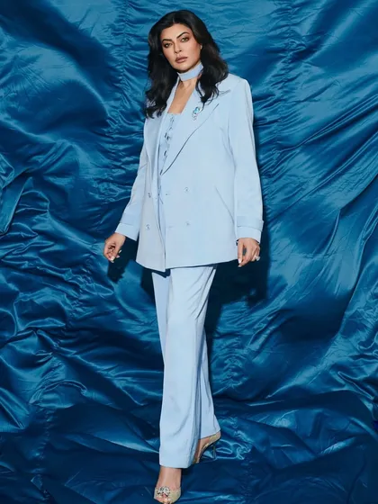 For the stunning Sushmita Sen, I created this chic, monochromatic look in powder blue. The three piece ensemble, featuring a blazer with a matching choker detail, is all about sophisticated and effortless elegance, perfect for a high profile celebrity appearance.