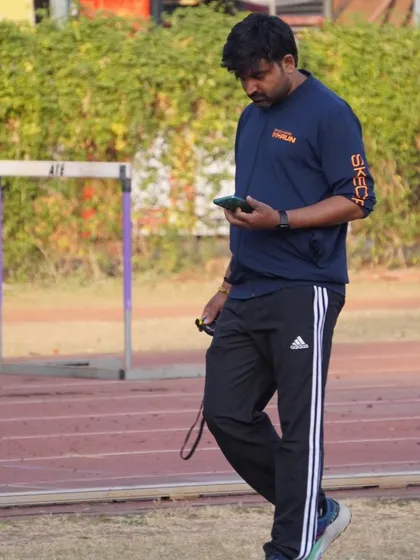 Reviewing performance data on my phone during a practice session.