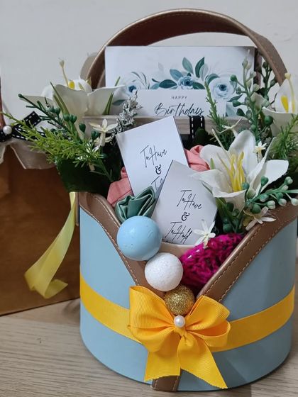 The full birthday basket with its matching paper bag, making for a complete and beautifully presented gift.