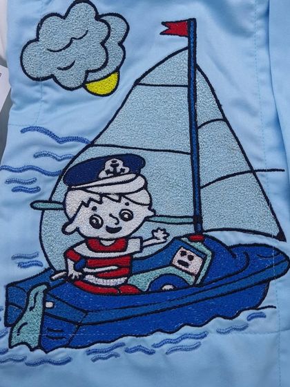 Another detail from the boat-themed saya kurta, showing a little sailor. I can create custom embroidery based on any theme for your child's outfit.