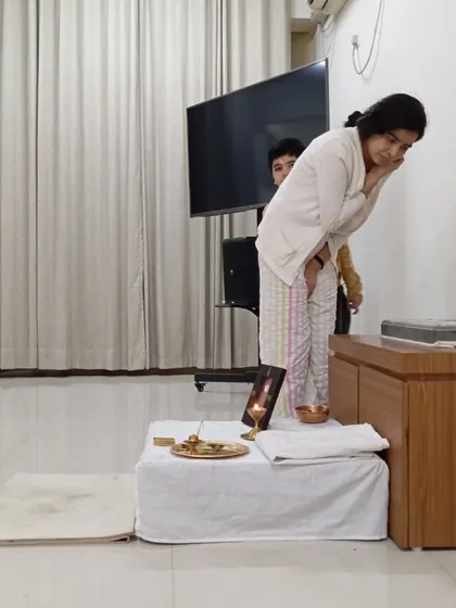 A moment of quiet reverence after the Sadhguru Sanidhi Pooja. The space allows for anyone, regardless of age or background, to connect with the Guru's grace.