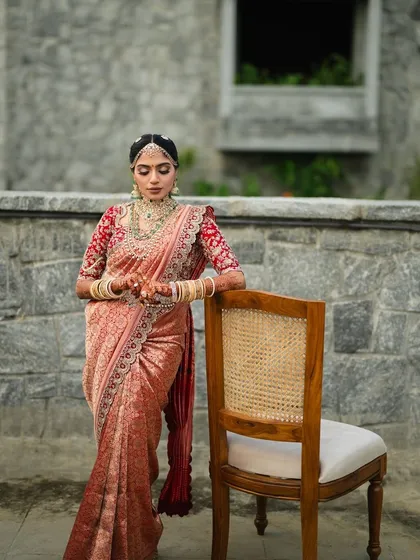 Our client exudes grace and poise in this stunning embellished saree. The intricate details and rich fabric make it a truly special piece for a wedding day.