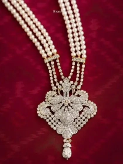 A closer look at the craftsmanship of this diamond and pearl bridal necklace. Every diamond is set by hand to maximize its brilliance, creating a piece that will be treasured for generations.