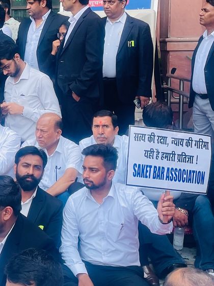 Holding a sign for the Saket Bar Association during our protest. Our pledge is to uphold the path of truth and the dignity of justice.