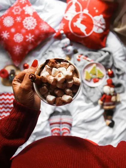 My Christmas mood is on! A cozy flatlay showing my holiday setup with hot chocolate, festive socks, and decorations. This is an example of personal, lifestyle content.