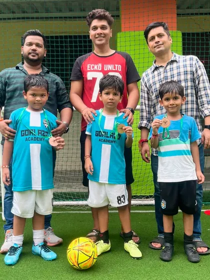 Another podium finish for our Under-7 team, posing with their medals and the supportive parents who cheer them on.