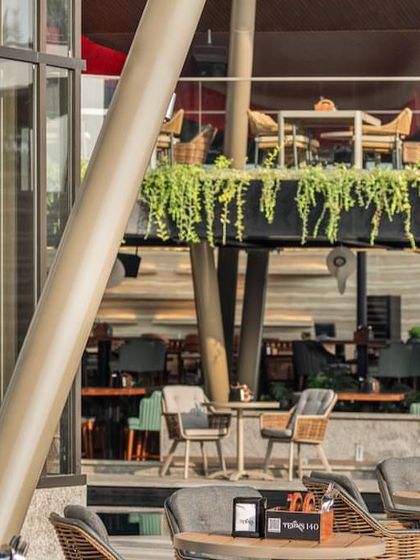 The multi-level design of the restobar creates a variety of seating experiences, from the open terrace to the covered upper deck.