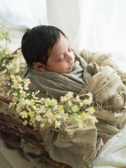 The use of natural window light creates beautiful, soft highlights and shadows in this peaceful side-profile shot.