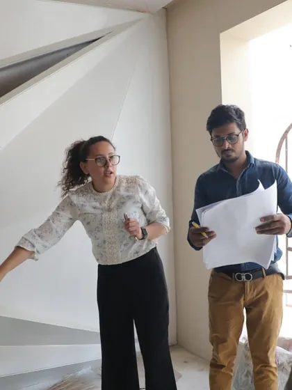 Our principal architect, Diana Espinoza, on-site, discussing design details with the team. This is where we bridge the gap between the blueprint and the built reality.