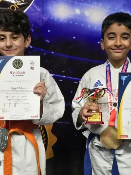The look of pure joy and accomplishment. Seeing my students with their hard-earned medals, trophies, and certificates after a championship is what makes all the training worthwhile.
