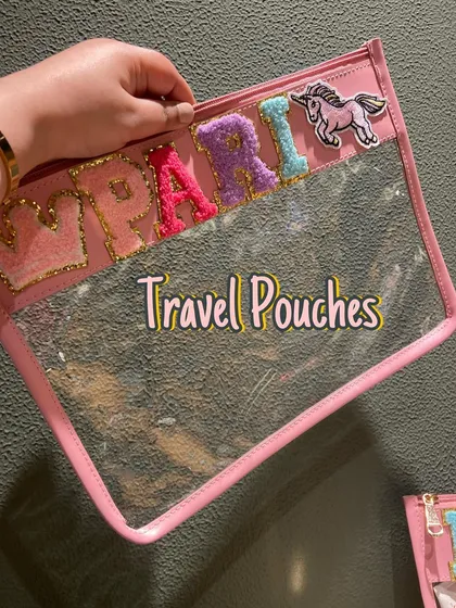 A pink version of our clear travel pouch, personalised for 'Pari' with a unicorn patch. Perfect for any adventure.