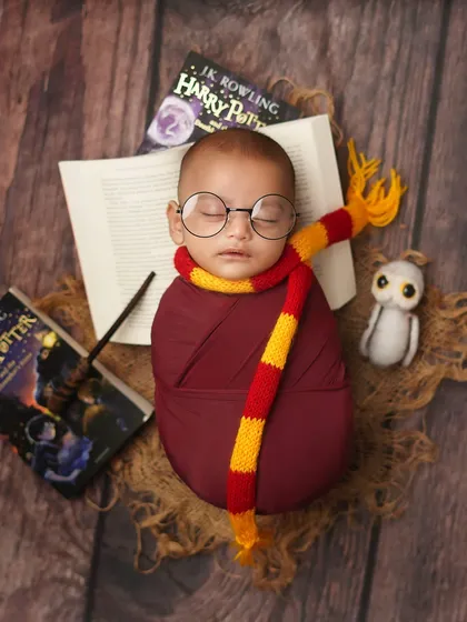 For the parents who dream of a little magic, I offer creative themed shoots. This little wizard, ready for his journey to Hogwarts, shows how we can bring a fun story to life. A Harry Potter themed newborn shoot is a unique way to celebrate your family's passions.