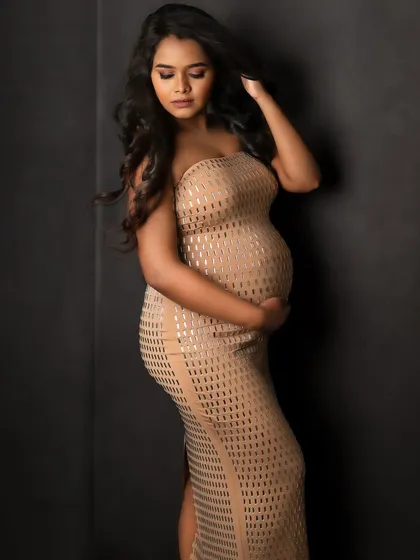 A quiet, introspective moment in a stunning textured gown. This pose is full of emotion and anticipation.