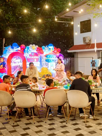 A glimpse of the happy guests enjoying a meal at a child's birthday party I planned. The background shows the colorful, character-themed stage decor, highlighting my ability to create a complete and immersive party experience.