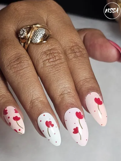 Simple yet elegant floral nail art on a clean base. This student work shows great control over fine lines and placement.