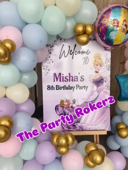 Another angle of the welcome sign, showing the different princess-themed foil balloons used in the decor.