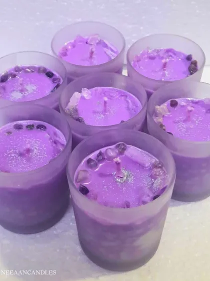 Pretty in lavender. These lavender-hued wax jars are topped with amethyst crystals to add a touch of serenity to your space.