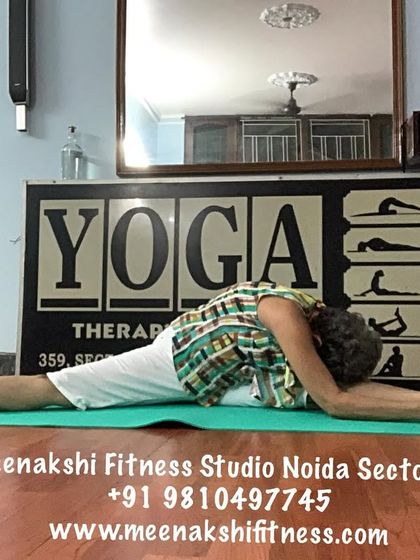 A full forward bend over one leg in a split, a very deep hamstring and hip stretch.