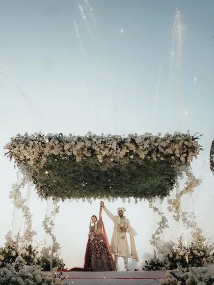 A floating mandap of baby's breath against the Goa sunset. This setup was all about minimalist beauty, letting the ocean backdrop and the couple's love story take center stage.