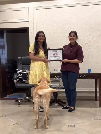 Another shot of me receiving my certification. The dog in the photo seems to be giving his approval too!